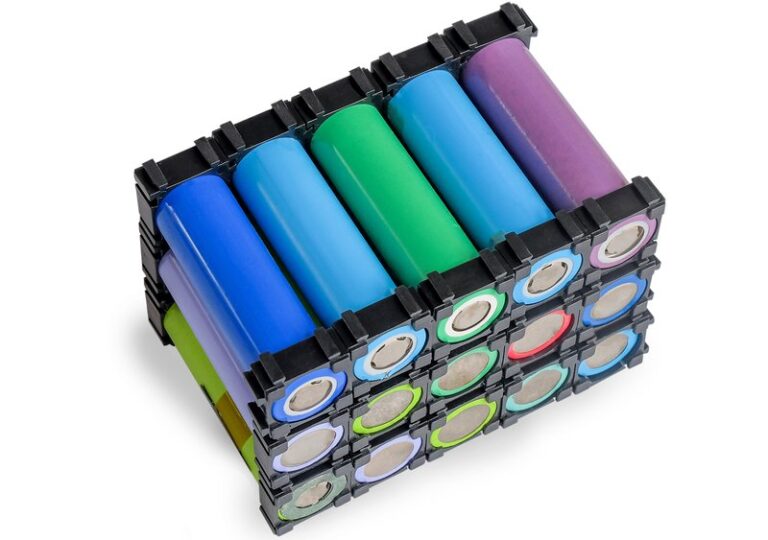 Reused Li ion 18650 battery pack in holder on white.